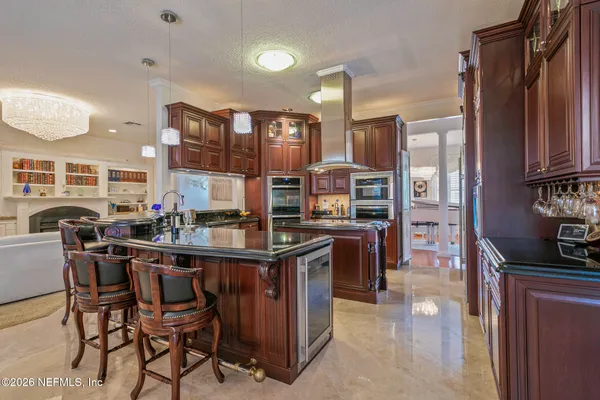 a bathroom with a sink a mirror and a shower