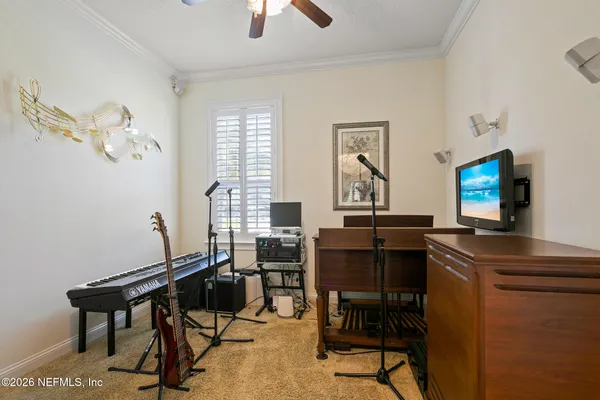 a view of living room with furniture and floor to ceiling windows
