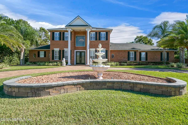 a view of a door and a window