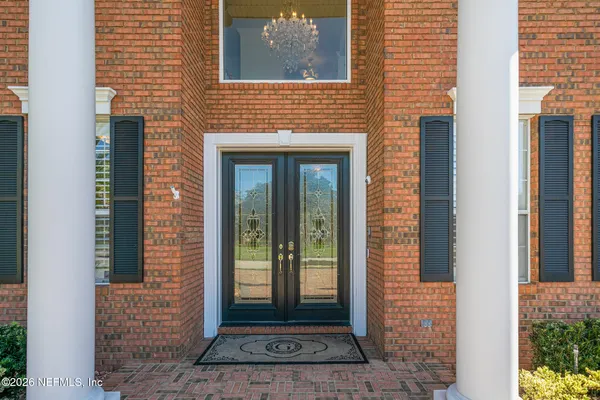 view of living room with furniture and floor to ceiling window