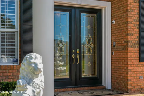 a view of a dining room with furniture wooden floor and chandelier