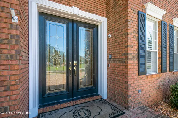 a kitchen with stainless steel appliances granite countertop a sink and a counter