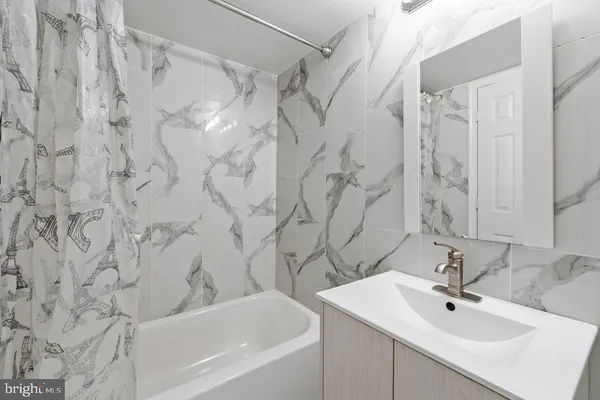 a bathroom with a sink and a bathtub