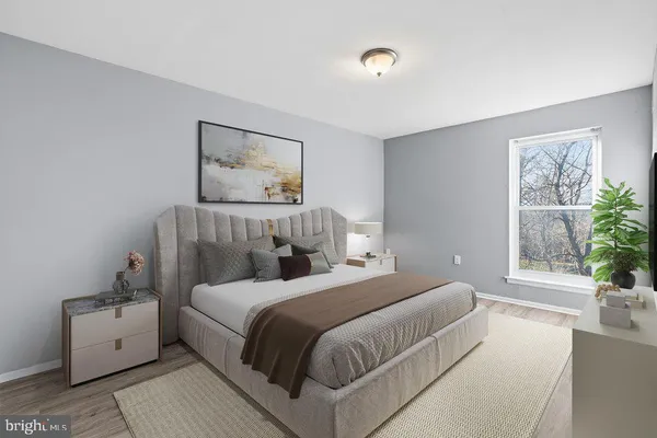 a bedroom with a large bed and a couch