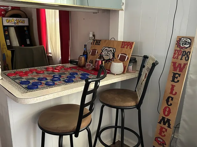 a living room with furniture and a rug