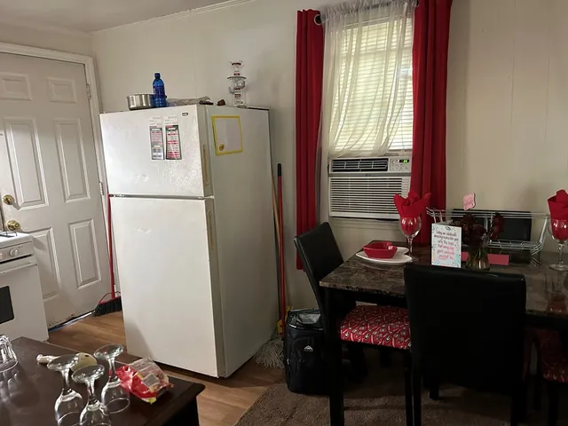 a room with furniture a rug and a window