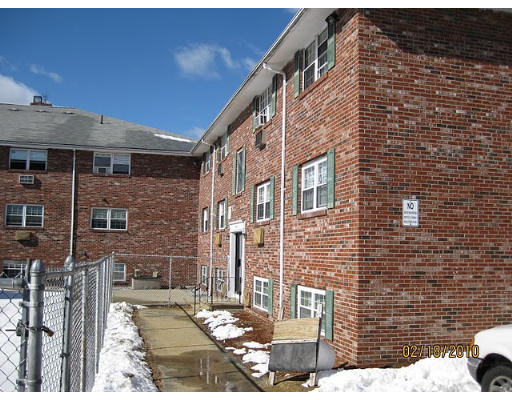 361 Hildreth Street, Unit 24 Lowell, MA 01850 - Photo 2 of 2 a brick building with a street