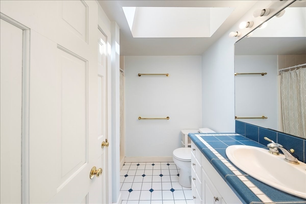10 2nd Street Natick, MA 01760 - Photo 25 of 31 a bathroom with a sink and a mirror