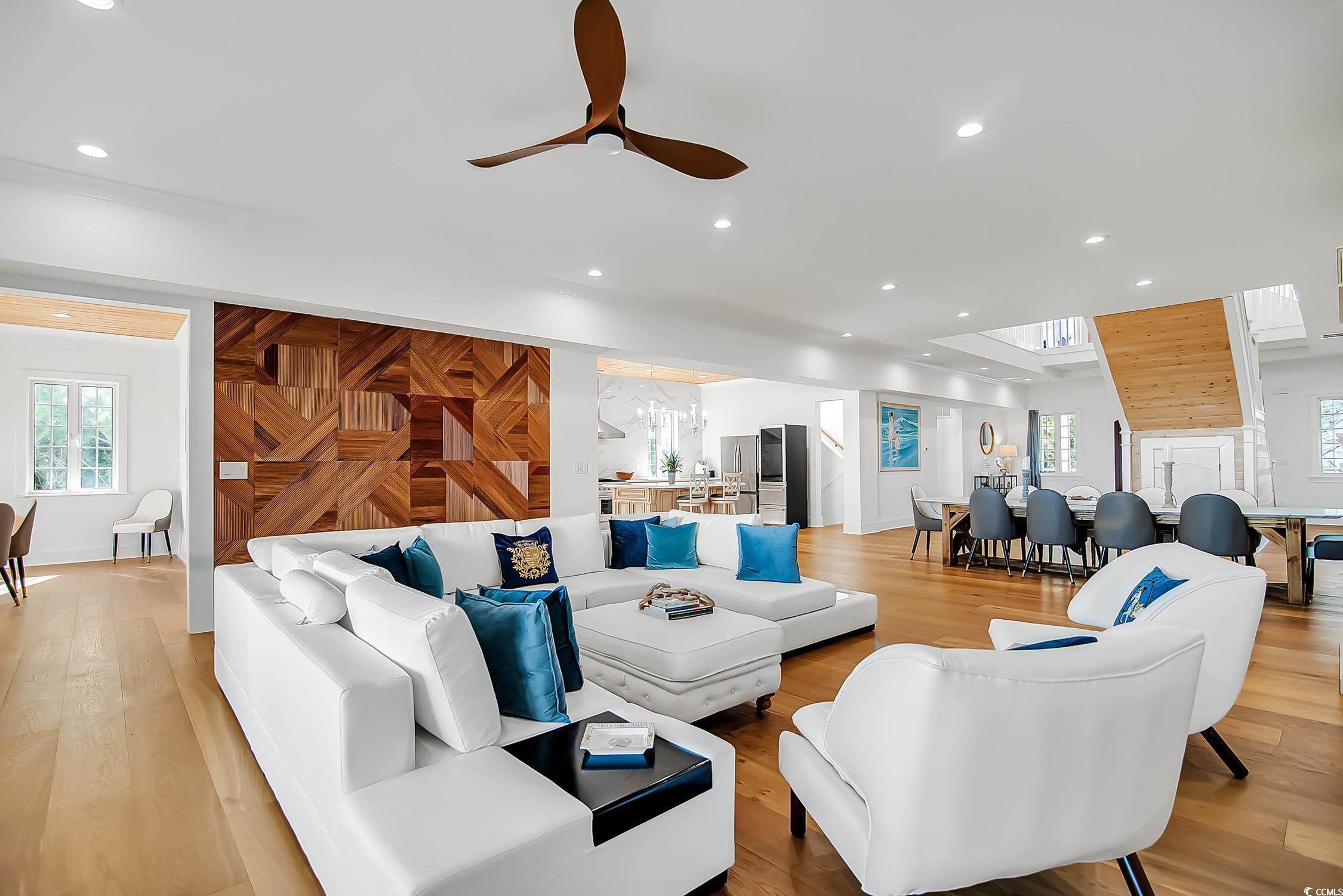 139 Pioneer Loop Georgetown, SC 29440 - Photo 11 of 39 Living room featuring a ceiling fan, wooden walls, light wood finished floors, and recessed lighting