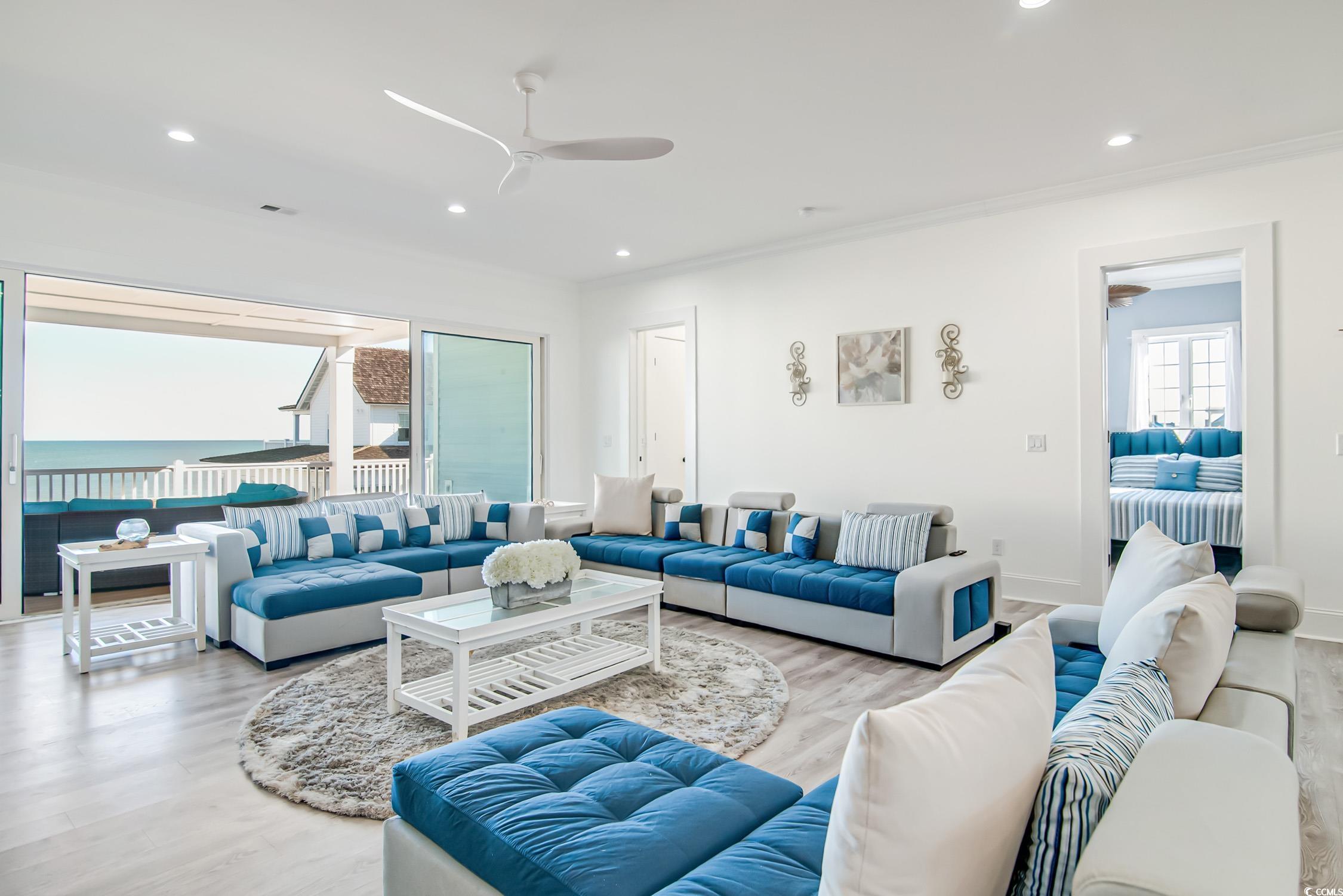 139 Pioneer Loop Georgetown, SC 29440 - Photo 21 of 39 Living area with recessed lighting, wood finished floors, ceiling fan, and ornamental molding