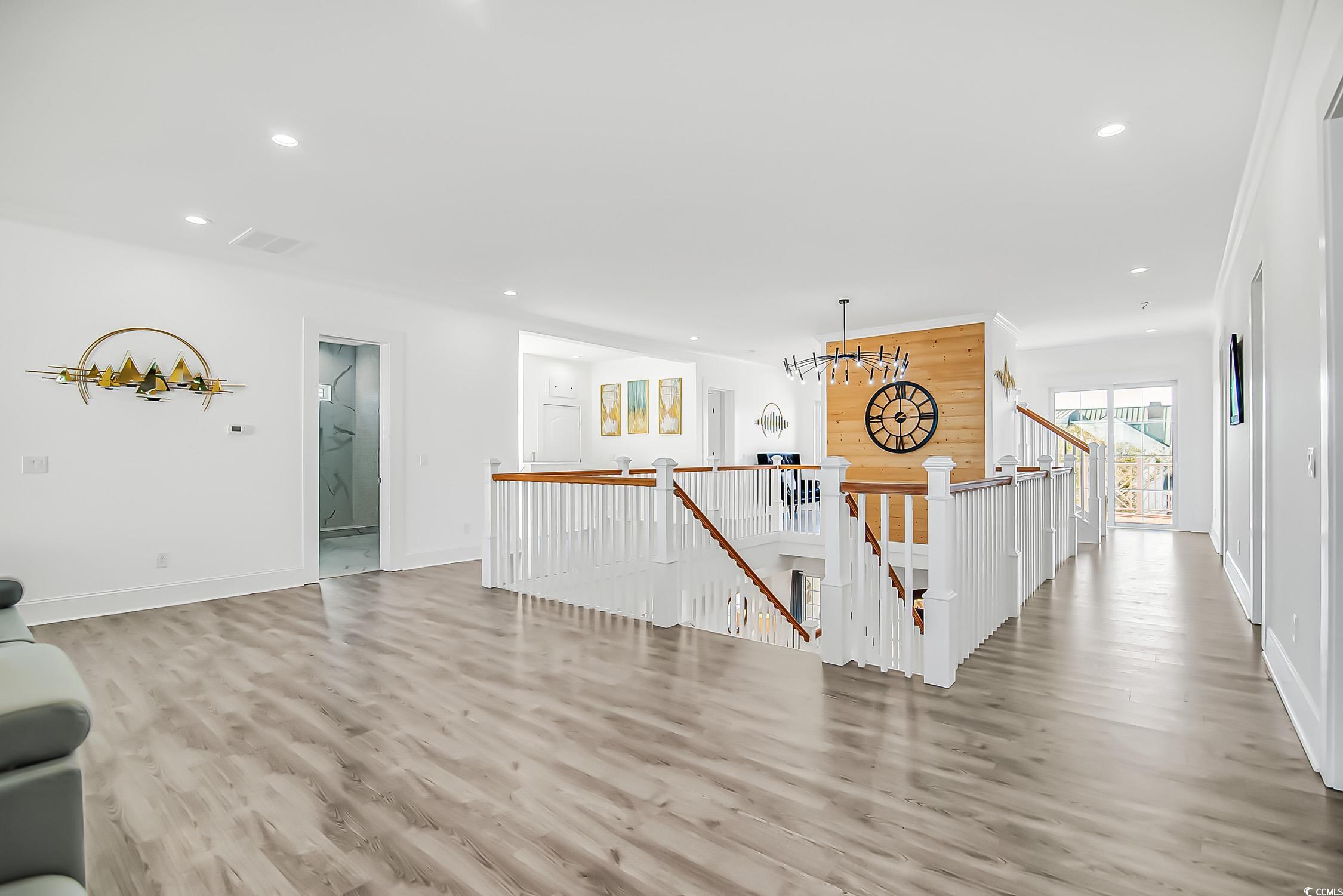 139 Pioneer Loop Georgetown, SC 29440 - Photo 22 of 39 Unfurnished living room with light wood-style flooring and recessed lighting