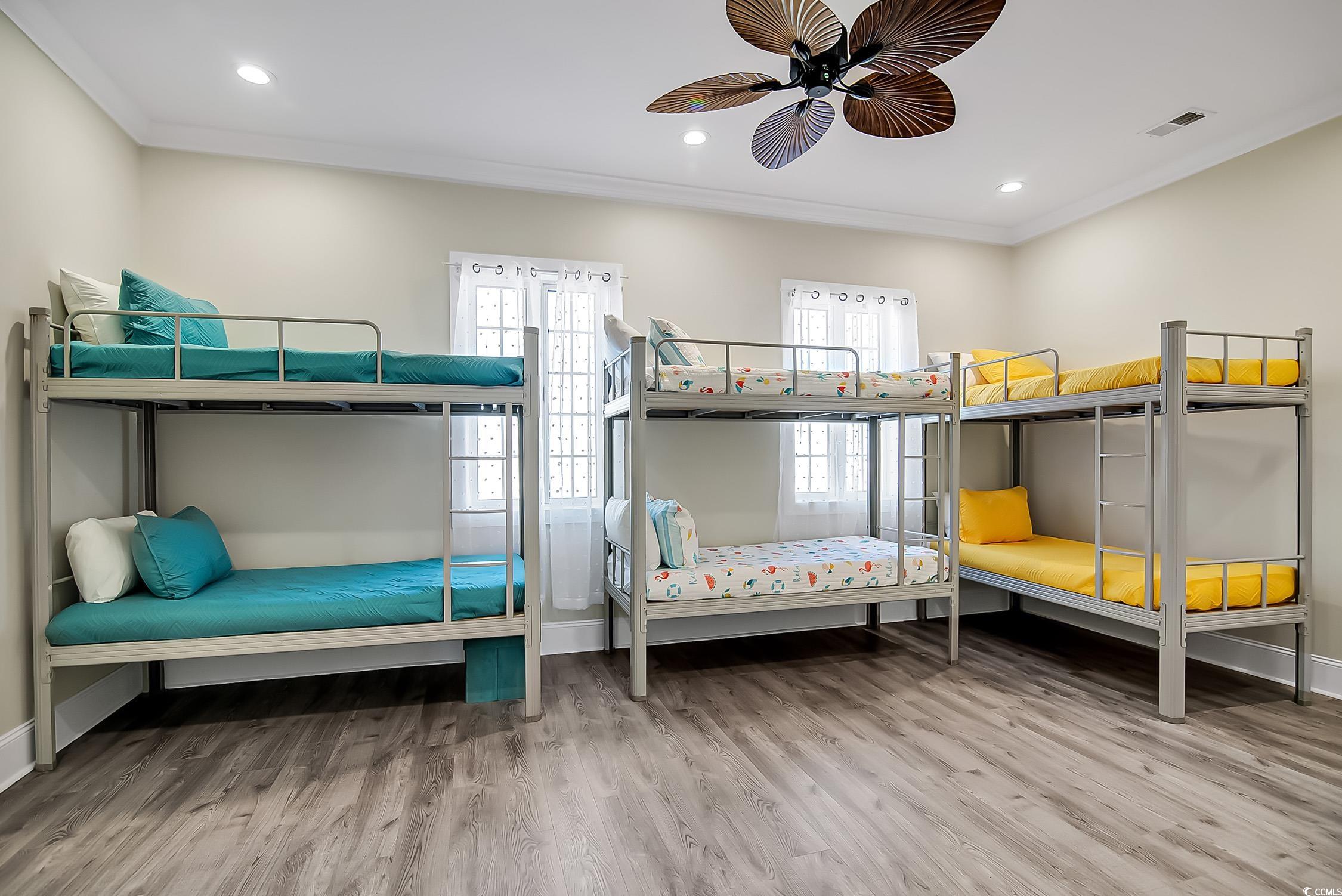 139 Pioneer Loop Georgetown, SC 29440 - Photo 25 of 39 Bedroom featuring multiple windows, light wood-style floors, ornamental molding, recessed lighting, and ceiling fan