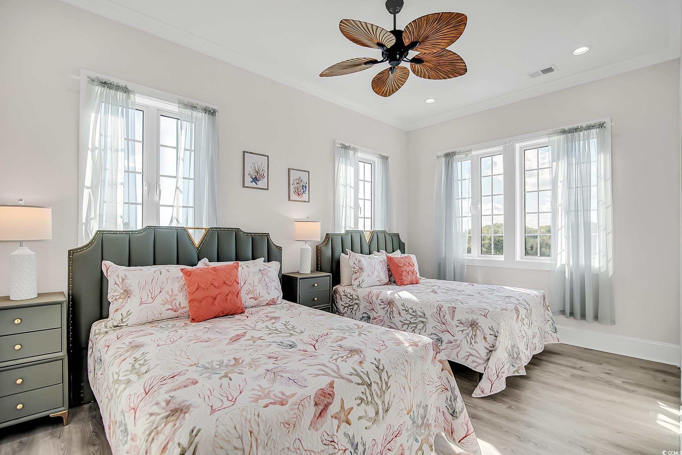 139 Pioneer Loop Georgetown, SC 29440 - Photo 35 of 39 Bedroom featuring light wood finished floors, ceiling fan, crown molding, and recessed lighting