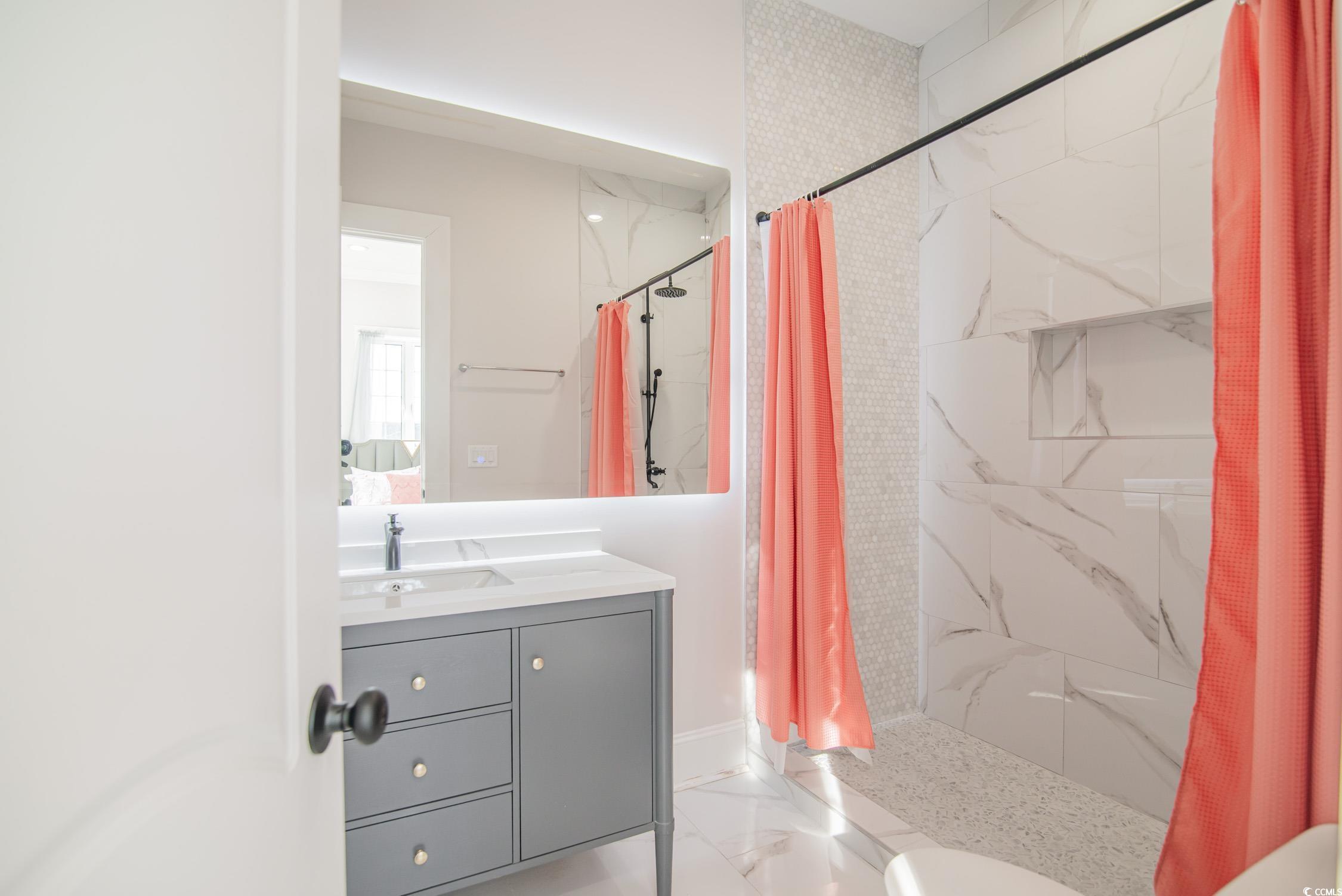 139 Pioneer Loop Georgetown, SC 29440 - Photo 36 of 39 Full bath featuring a marble finish shower and vanity