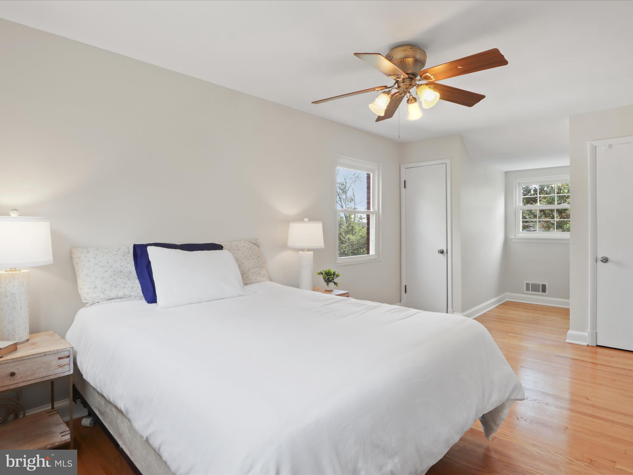 3106 63rd Place Cheverly, MD 20785 - Photo 17 of 42 a bedroom with a bed and a chandelier