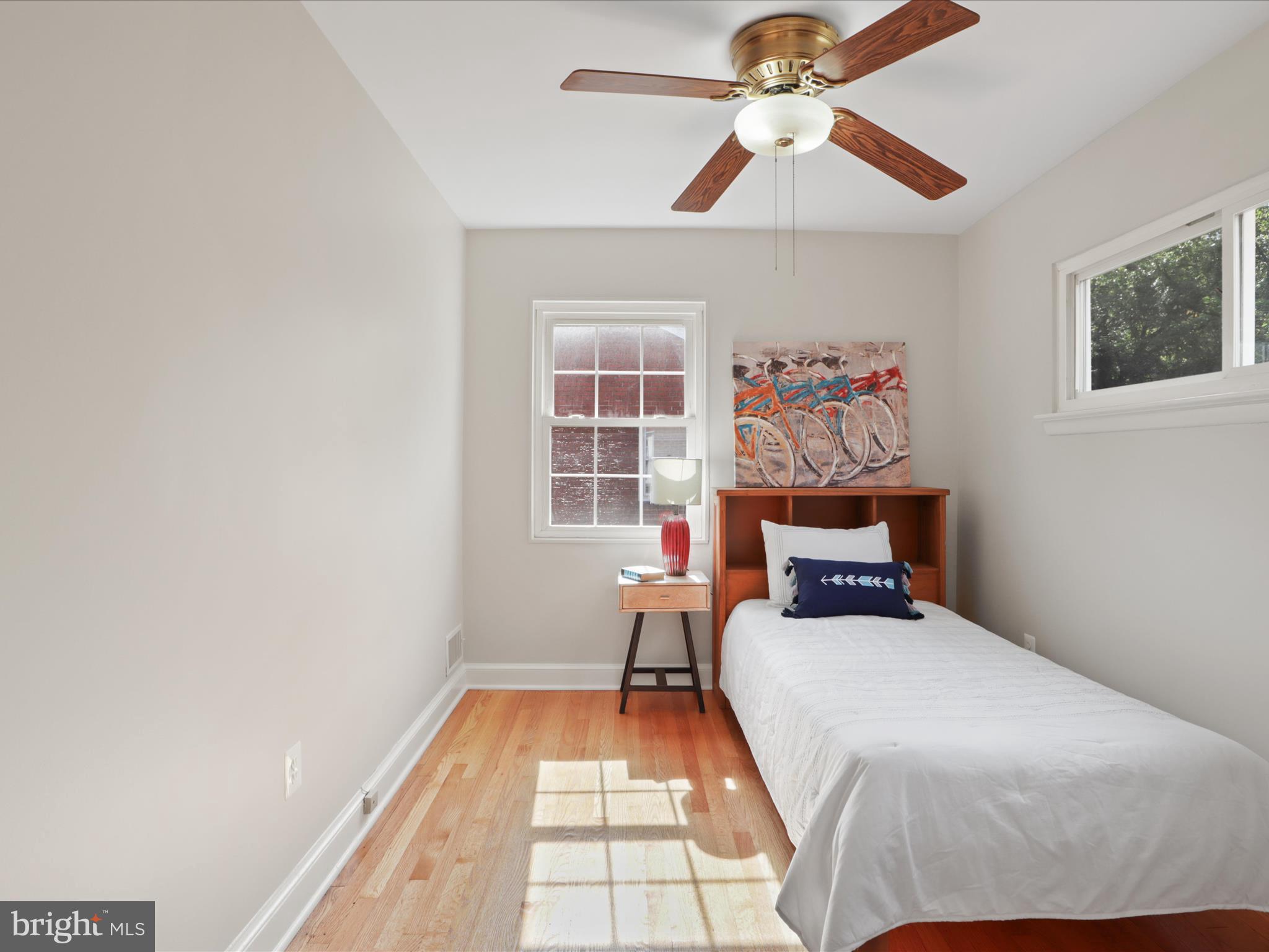 3106 63rd Place Cheverly, MD 20785 - Photo 18 of 42 a bed room with a bed and a chandelier