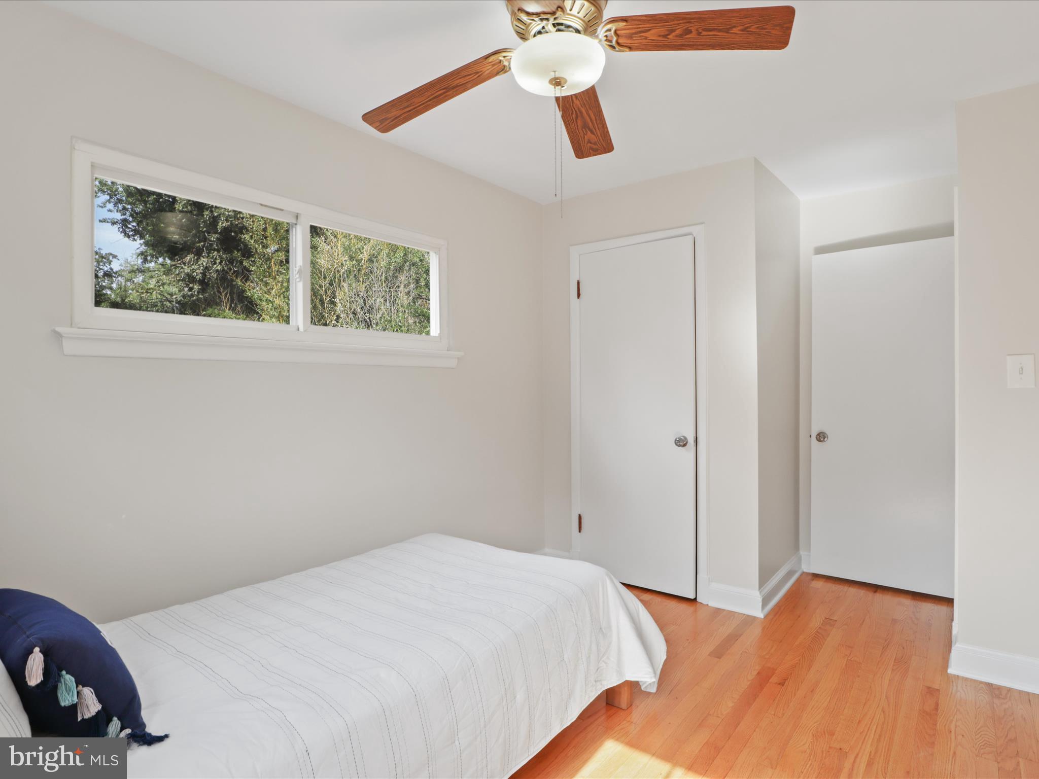3106 63rd Place Cheverly, MD 20785 - Photo 19 of 42 a bedroom with a bed and a painting on the wall