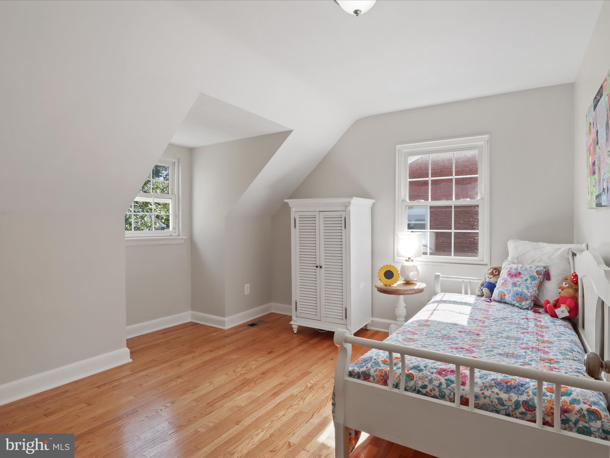 3106 63rd Place Cheverly, MD 20785 - Photo 20 of 42 a bedroom with a bed and wooden floor