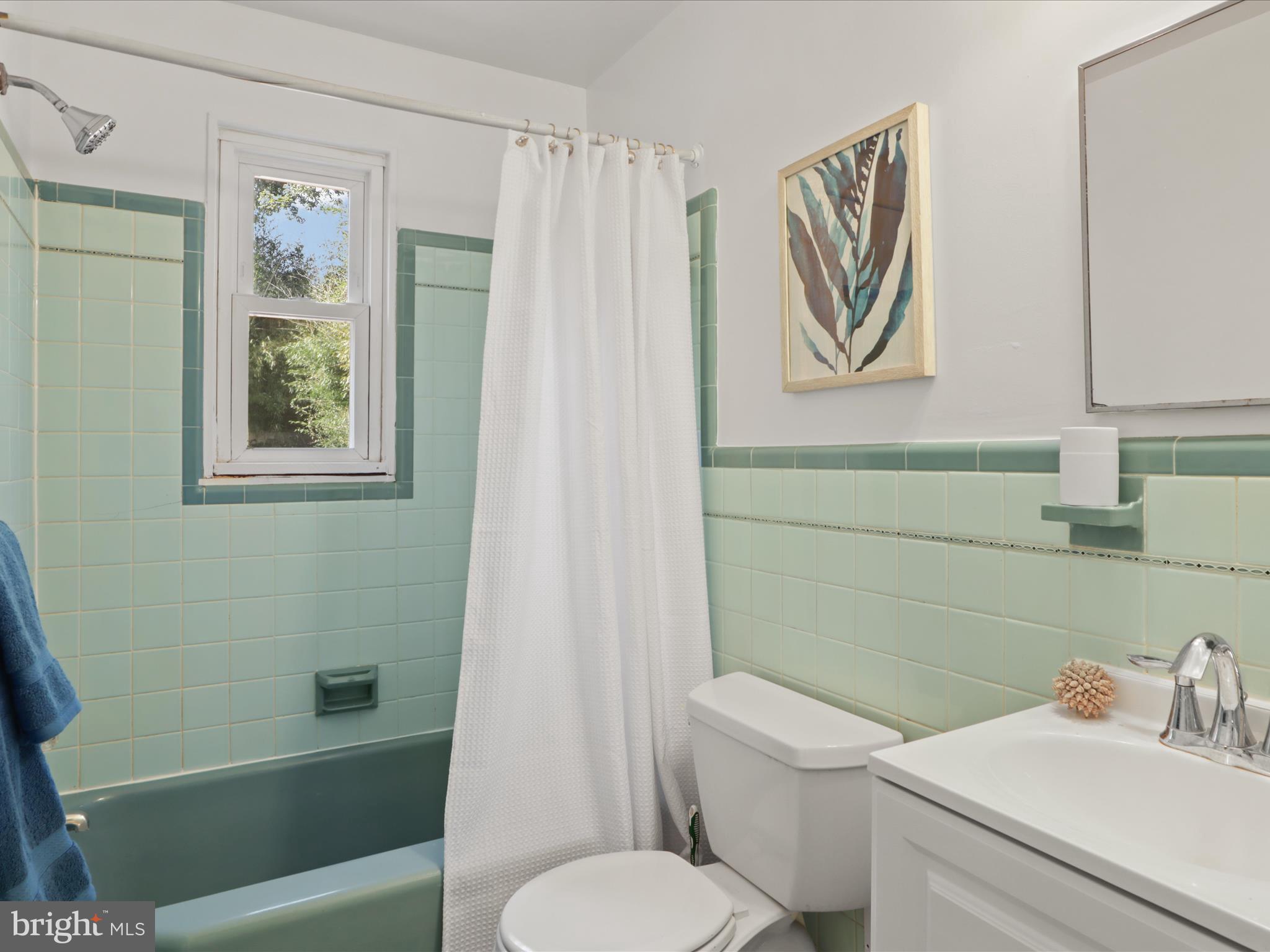 3106 63rd Place Cheverly, MD 20785 - Photo 23 of 42 a bathroom with a toilet and a sink