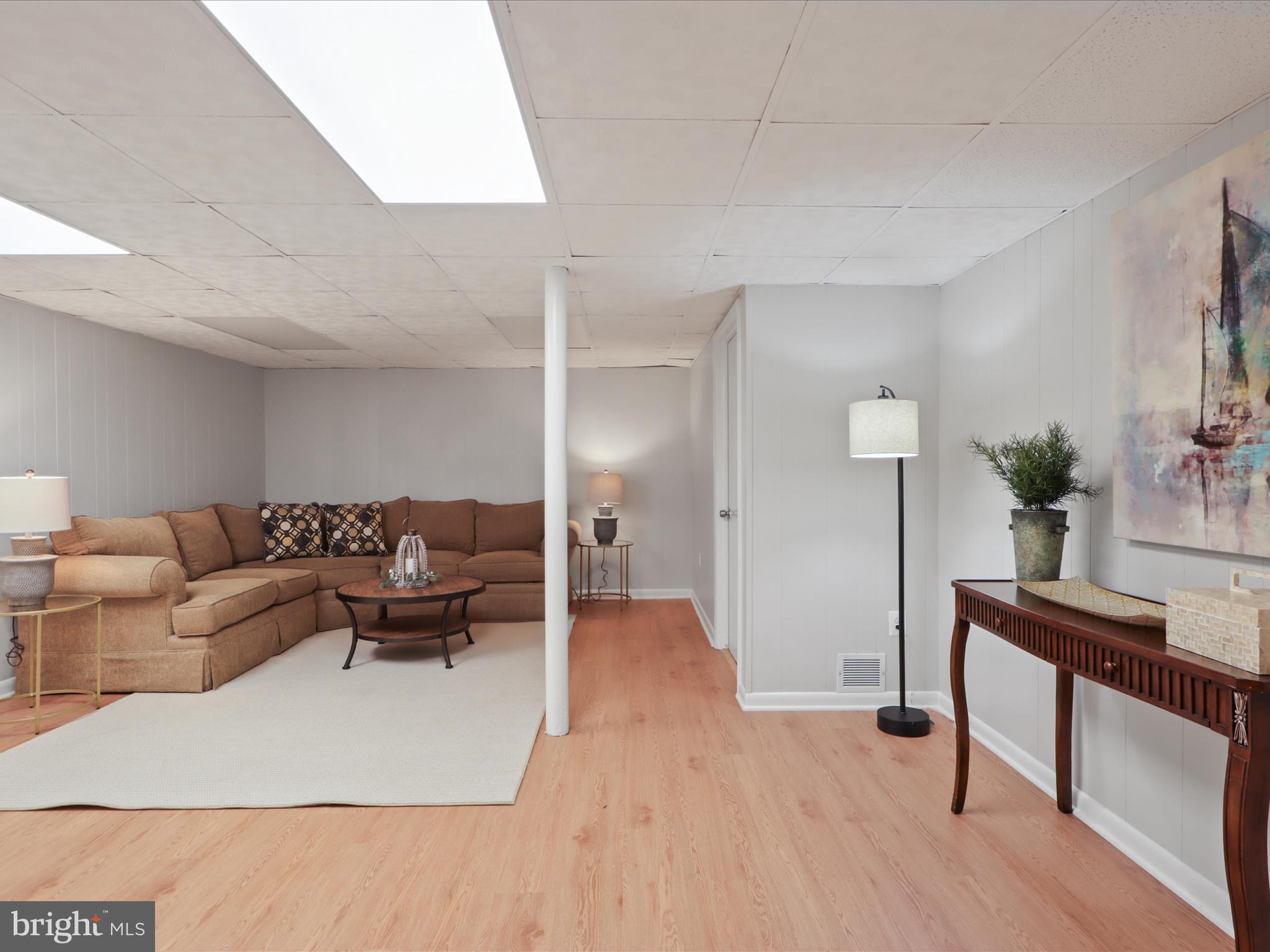 3106 63rd Place Cheverly, MD 20785 - Photo 24 of 42 a living room with furniture and a wooden floor