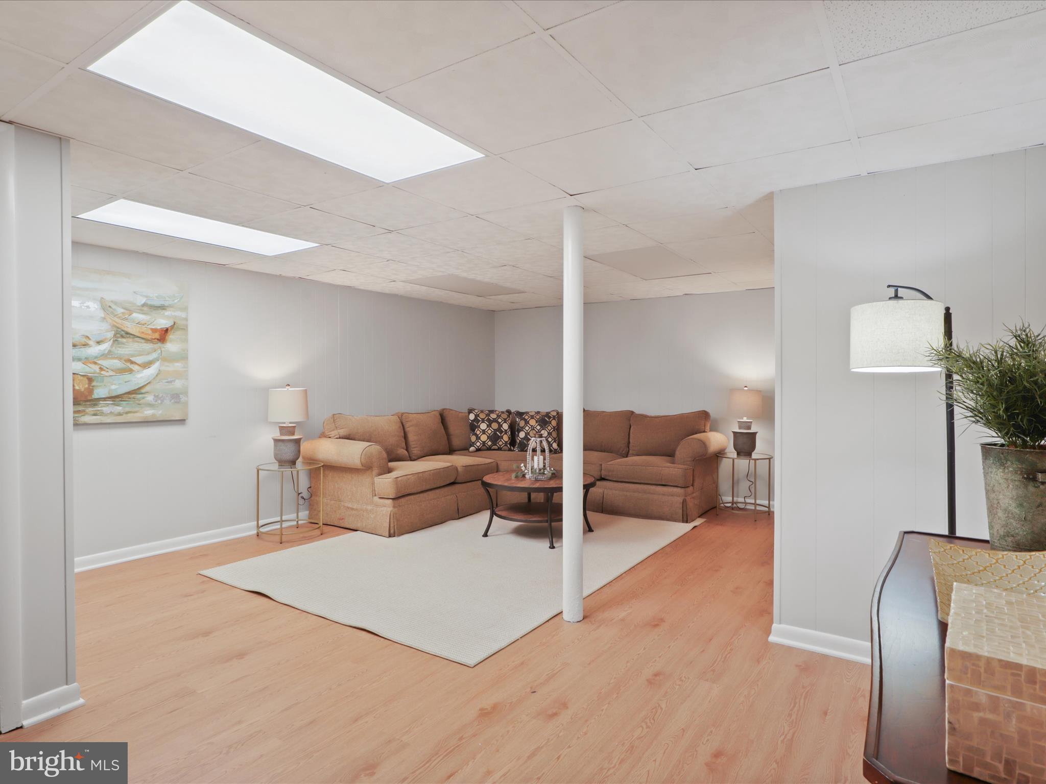 3106 63rd Place Cheverly, MD 20785 - Photo 25 of 42 a living room with furniture and wooden floor