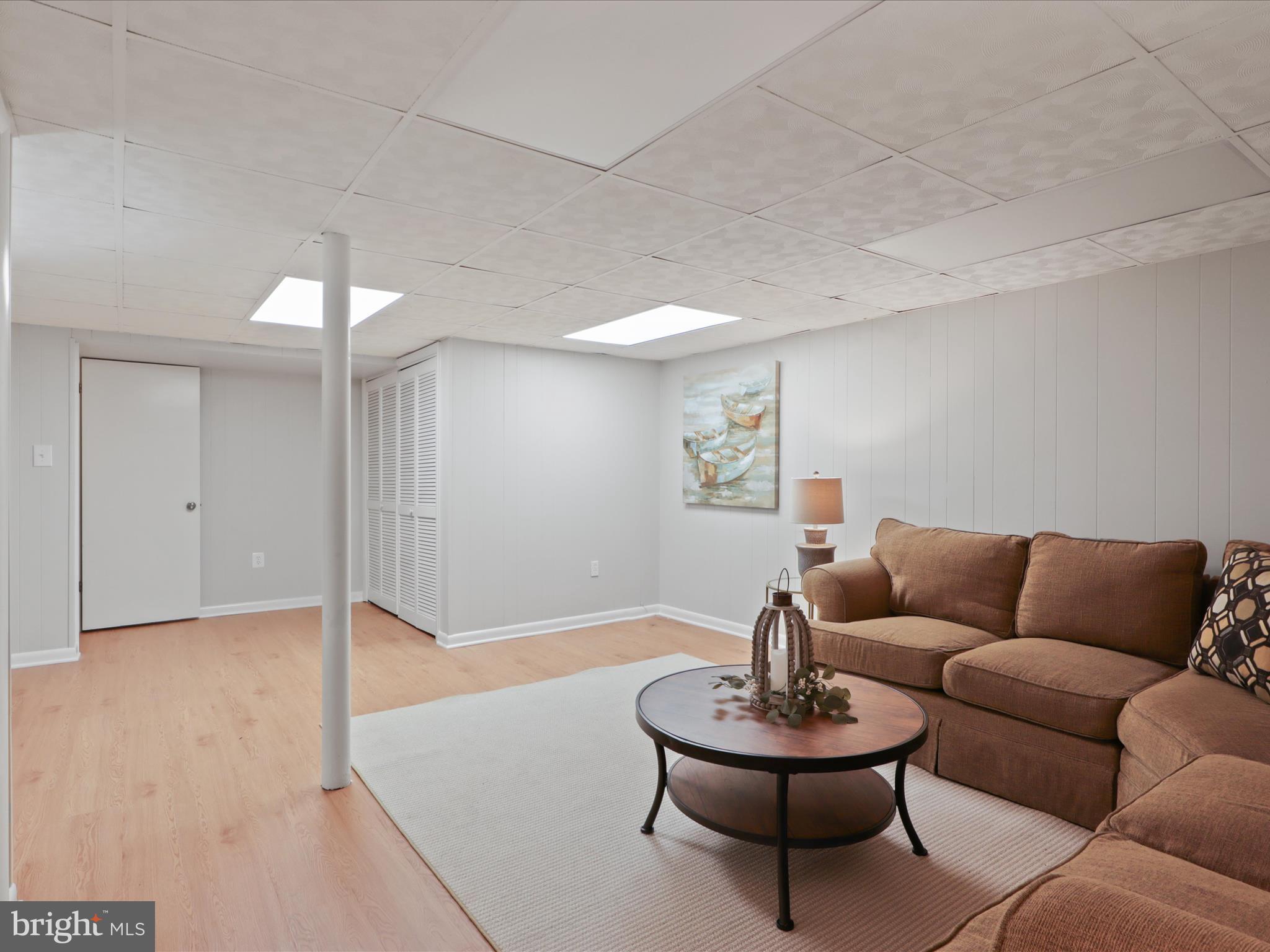 3106 63rd Place Cheverly, MD 20785 - Photo 26 of 42 a living room with furniture and a potted plant