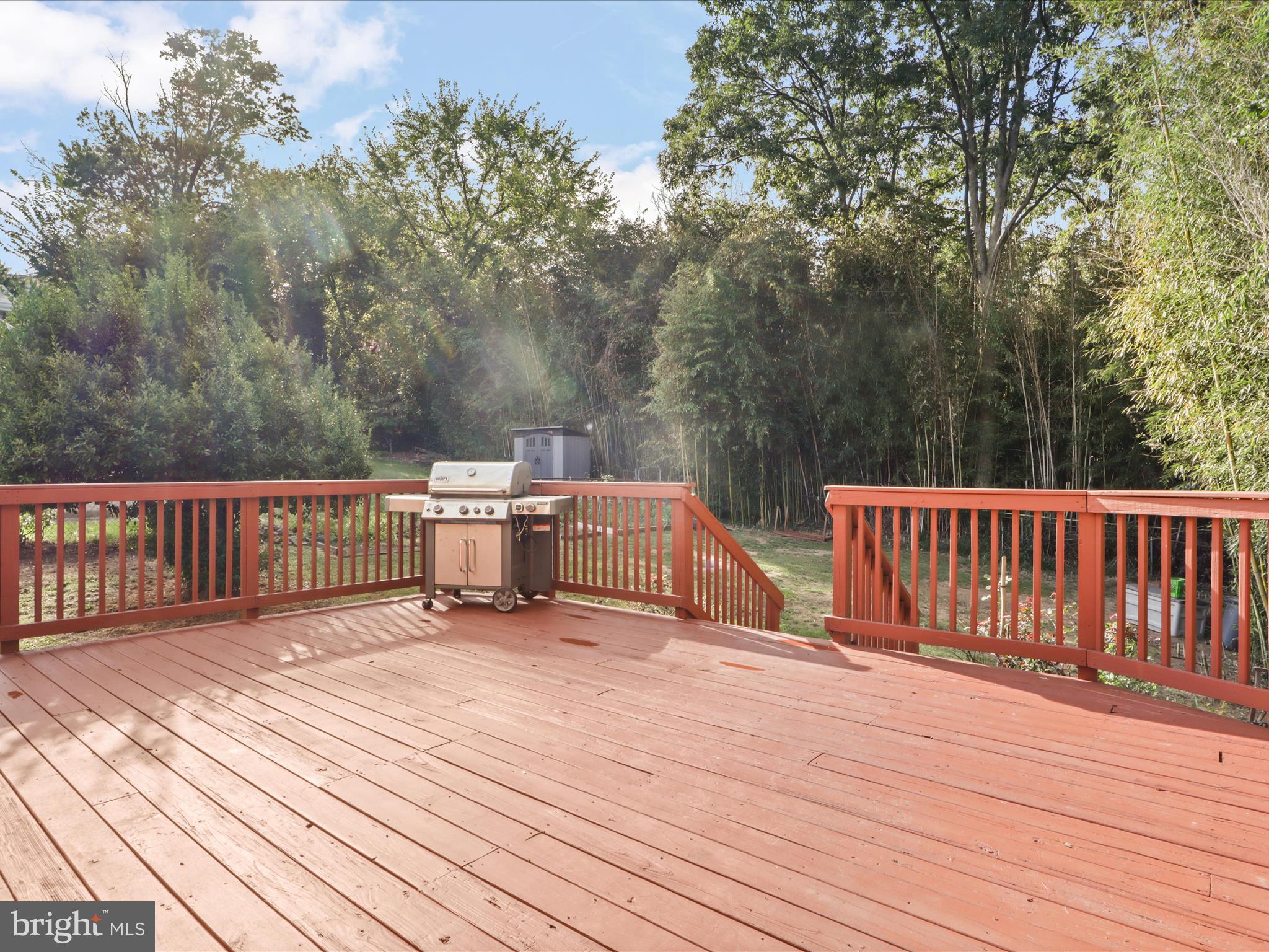 3106 63rd Place Cheverly, MD 20785 - Photo 30 of 42 a view of a deck with wooden floor and fence next to a yard