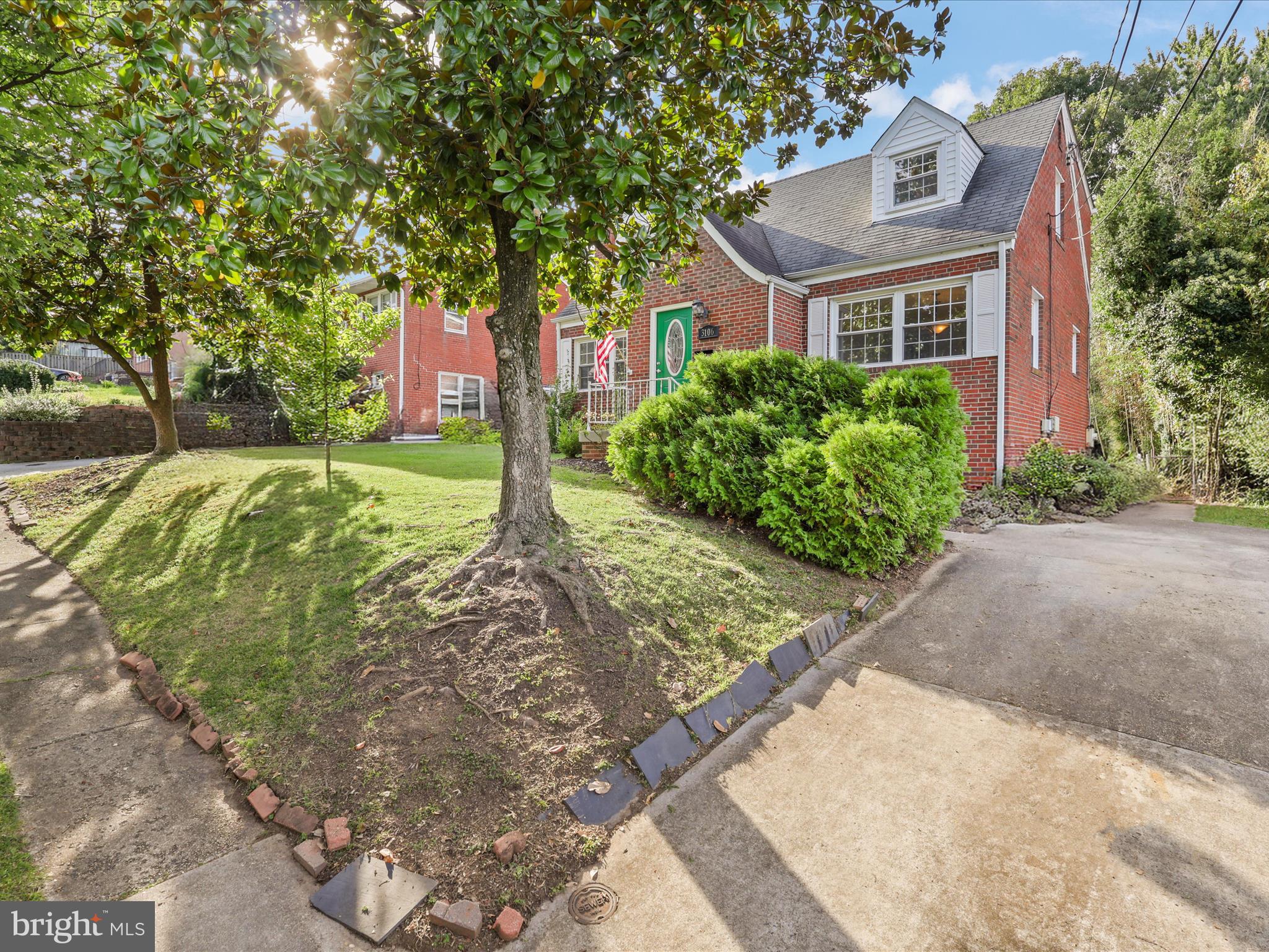 3106 63rd Place Cheverly, MD 20785 - Photo 3 of 42 a front view of a house with garden