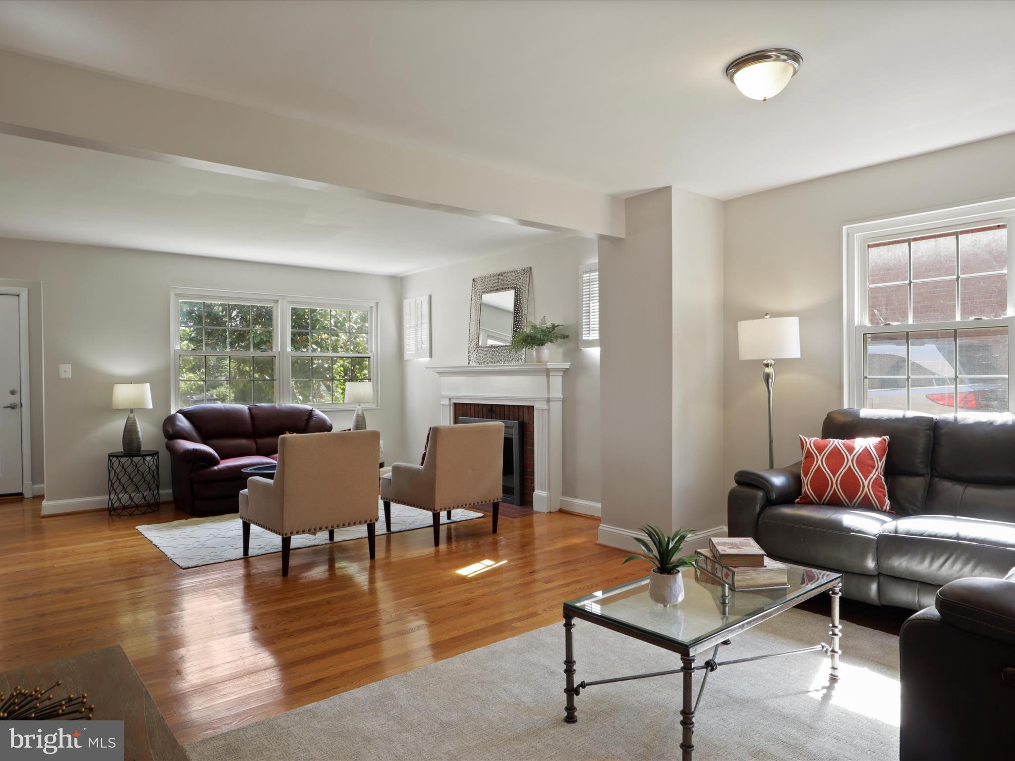 3106 63rd Place Cheverly, MD 20785 - Photo 38 of 42 a living room with furniture and a fireplace