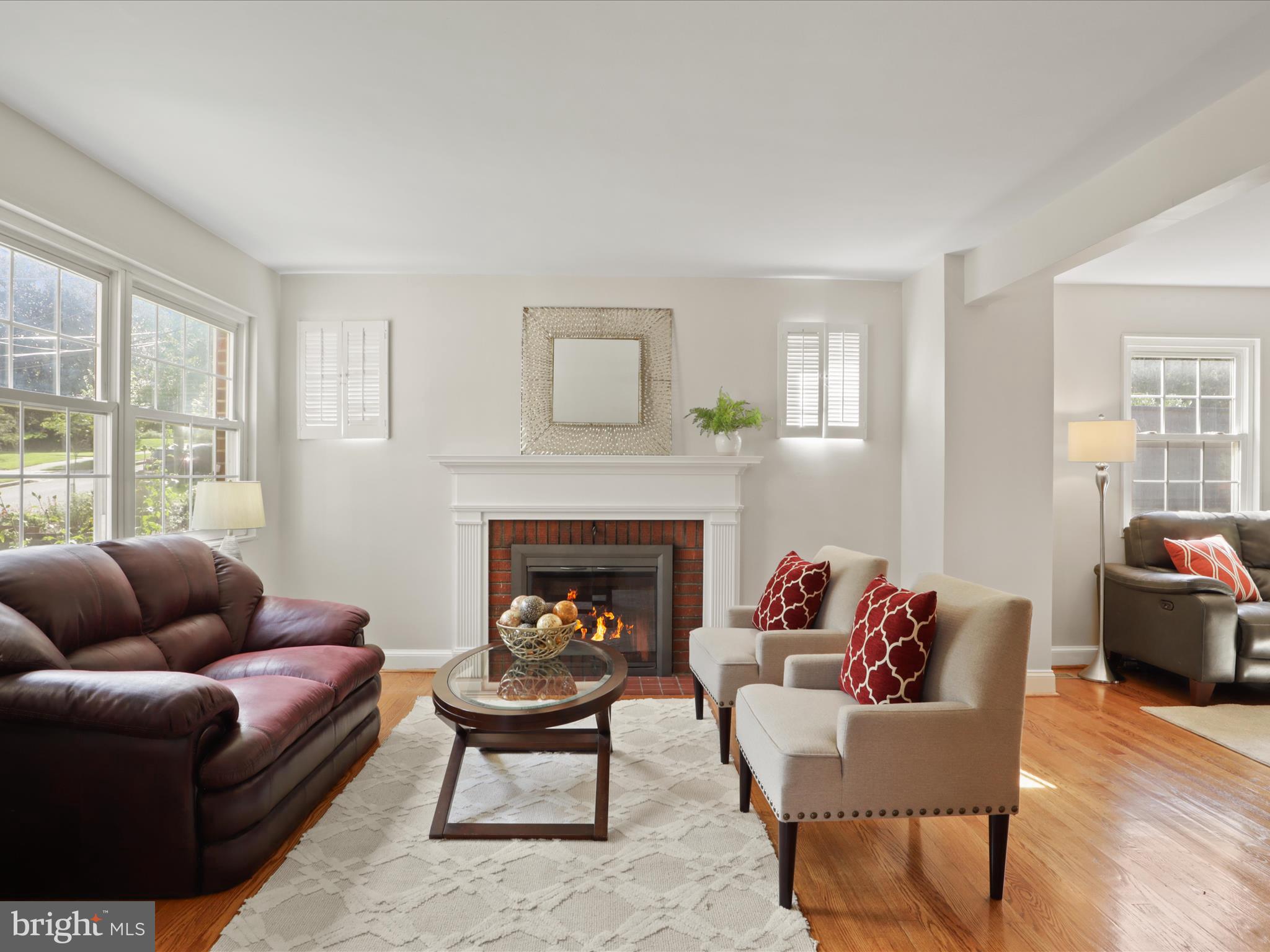 3106 63rd Place Cheverly, MD 20785 - Photo 7 of 42 a living room with furniture and a fireplace