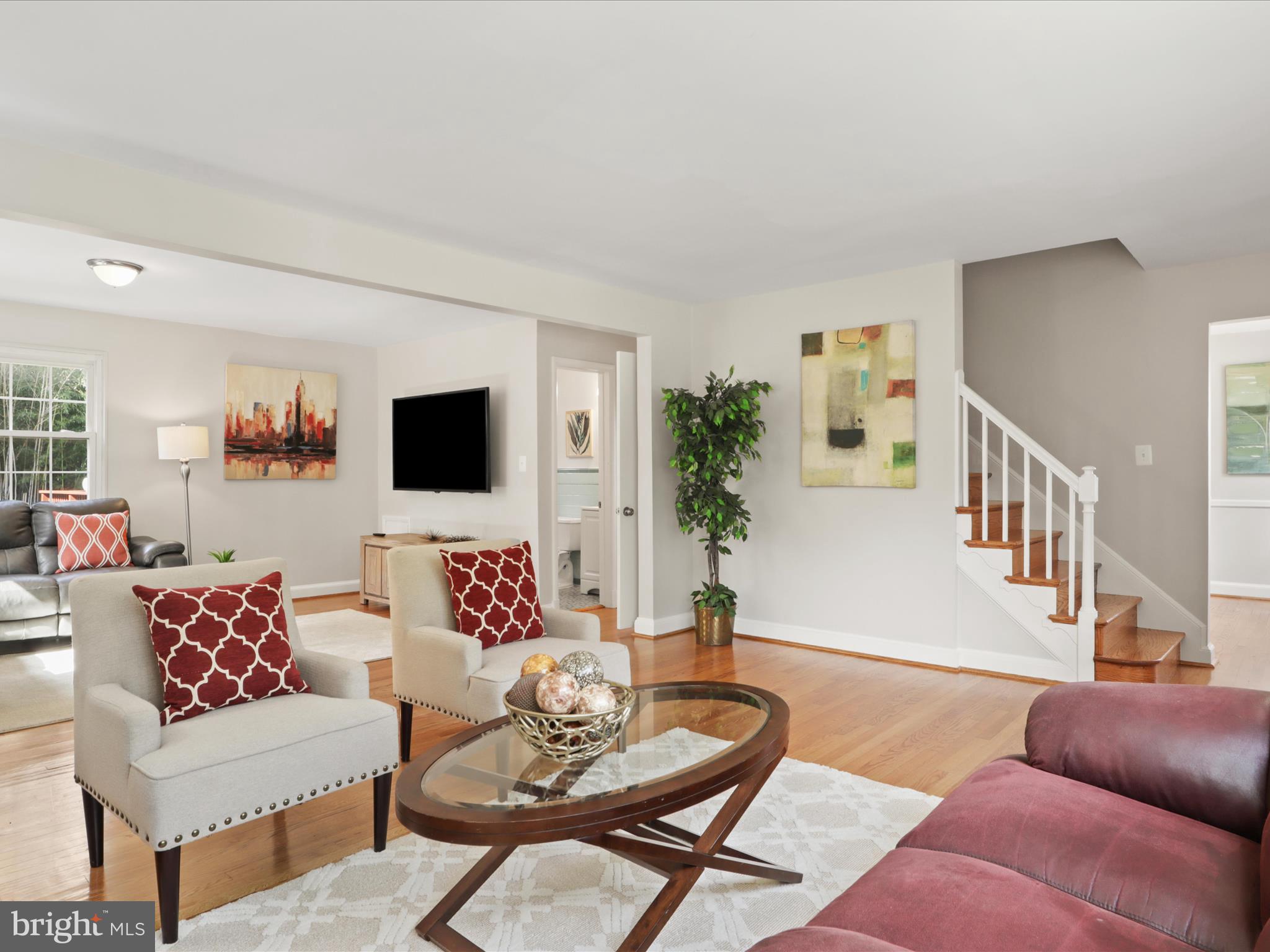 3106 63rd Place Cheverly, MD 20785 - Photo 8 of 42 a living room with furniture and a flat screen tv