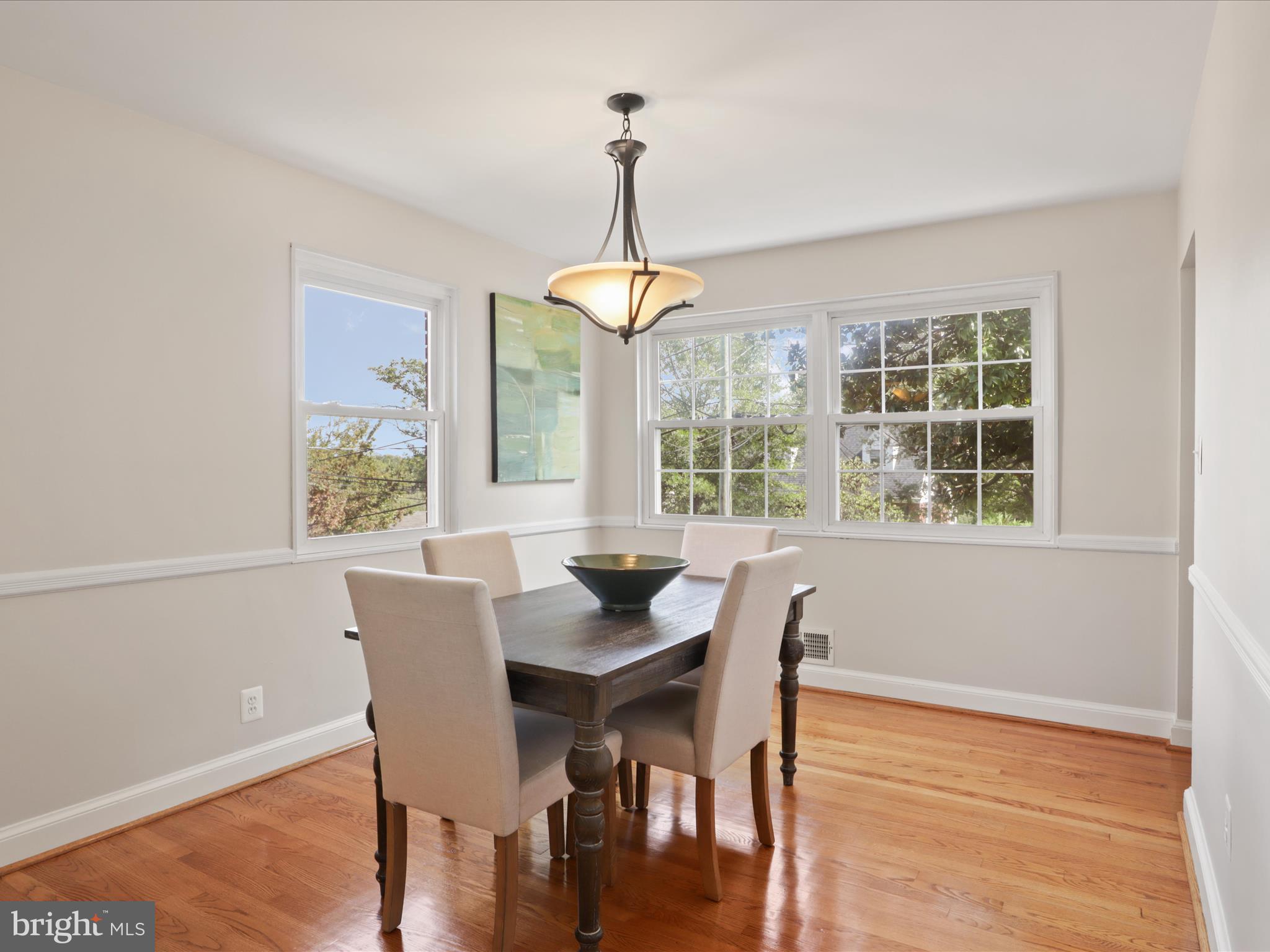 3106 63rd Place Cheverly, MD 20785 - Photo 9 of 42 a dining room with furniture window wooden floor