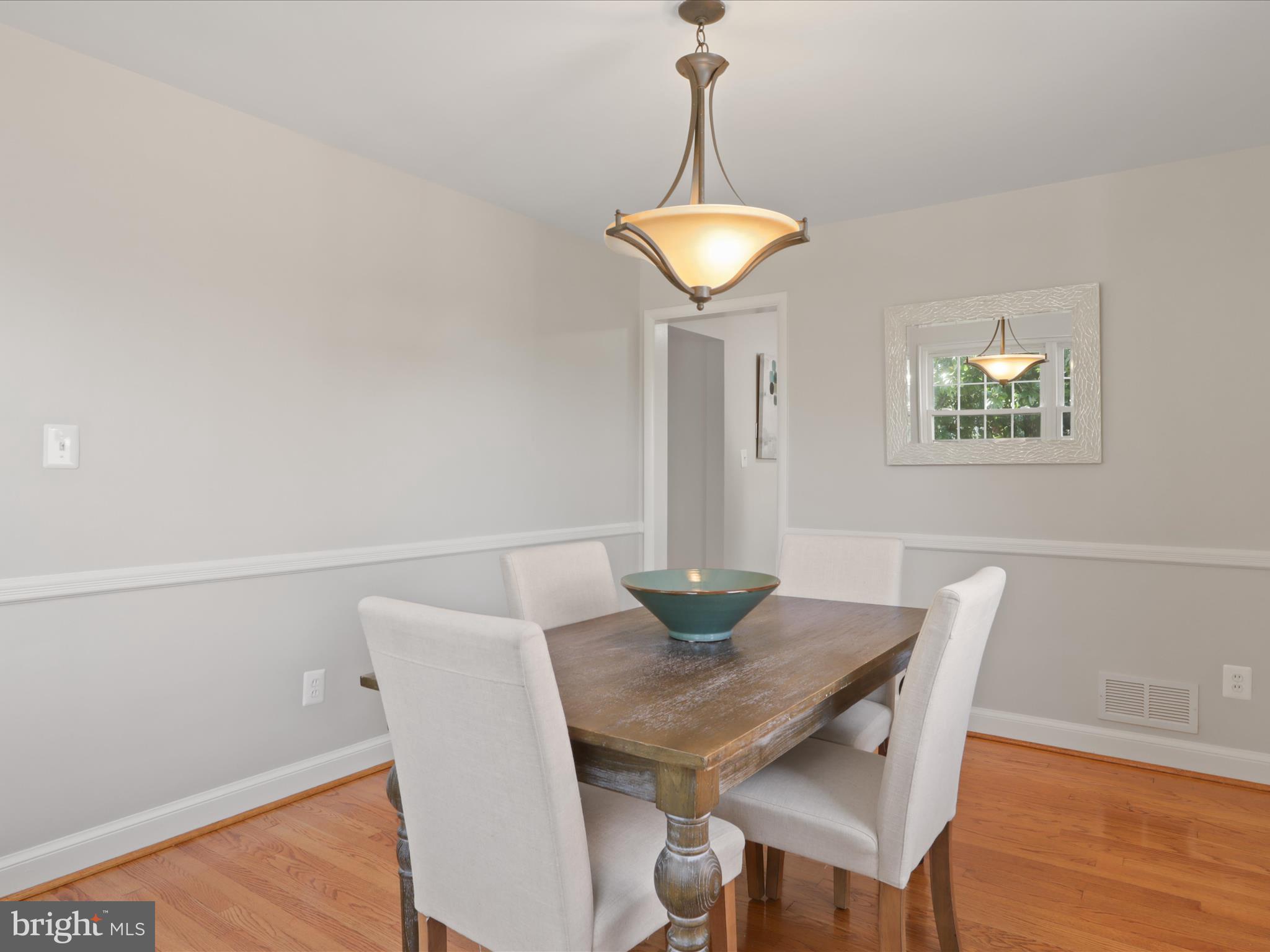 3106 63rd Place Cheverly, MD 20785 - Photo 10 of 42 a view of a dining room with furniture and wooden floor