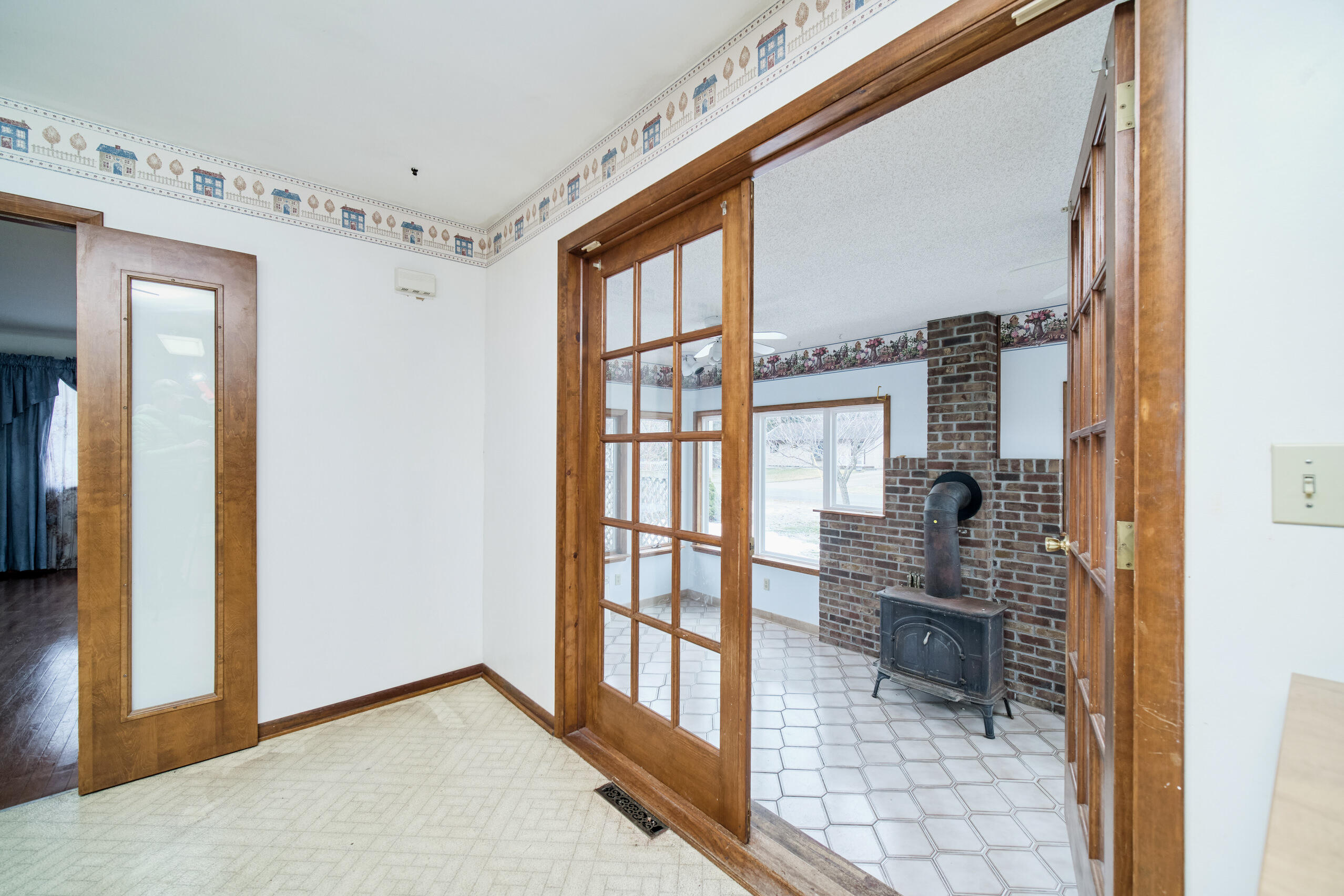 302 Condon Road Manistee, MI 49660 - Photo 27 of 56 Paned doors lead to sun room