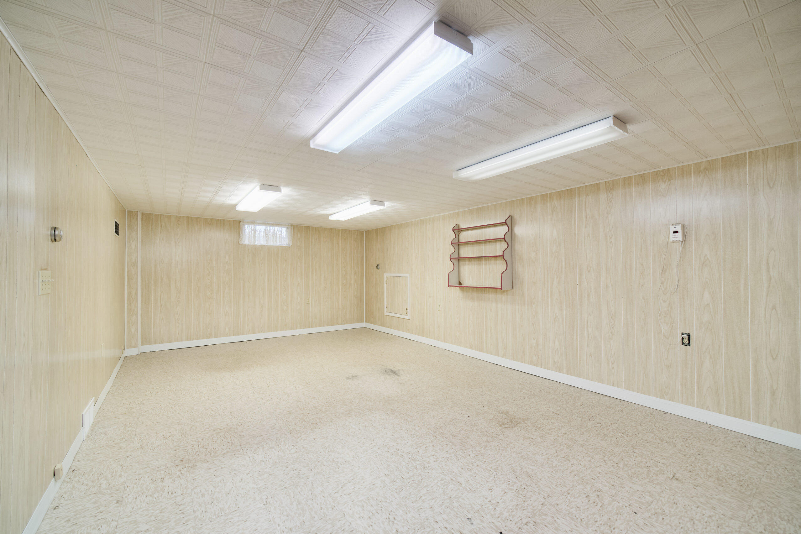 302 Condon Road Manistee, MI 49660 - Photo 31 of 56 Finished rec room in basement