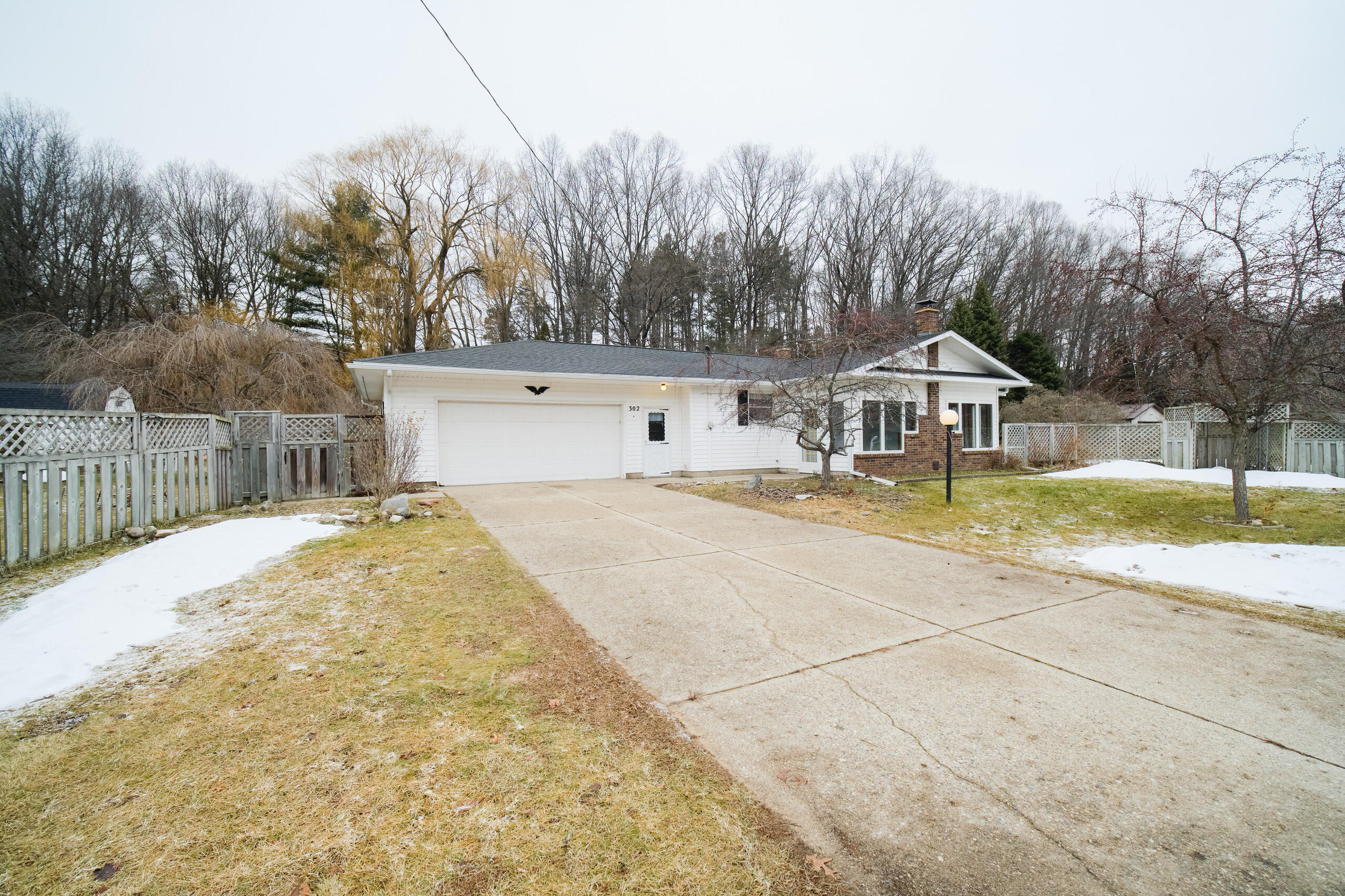 302 Condon Road Manistee, MI 49660 - Photo 37 of 56 Concrete drive to attached garage
