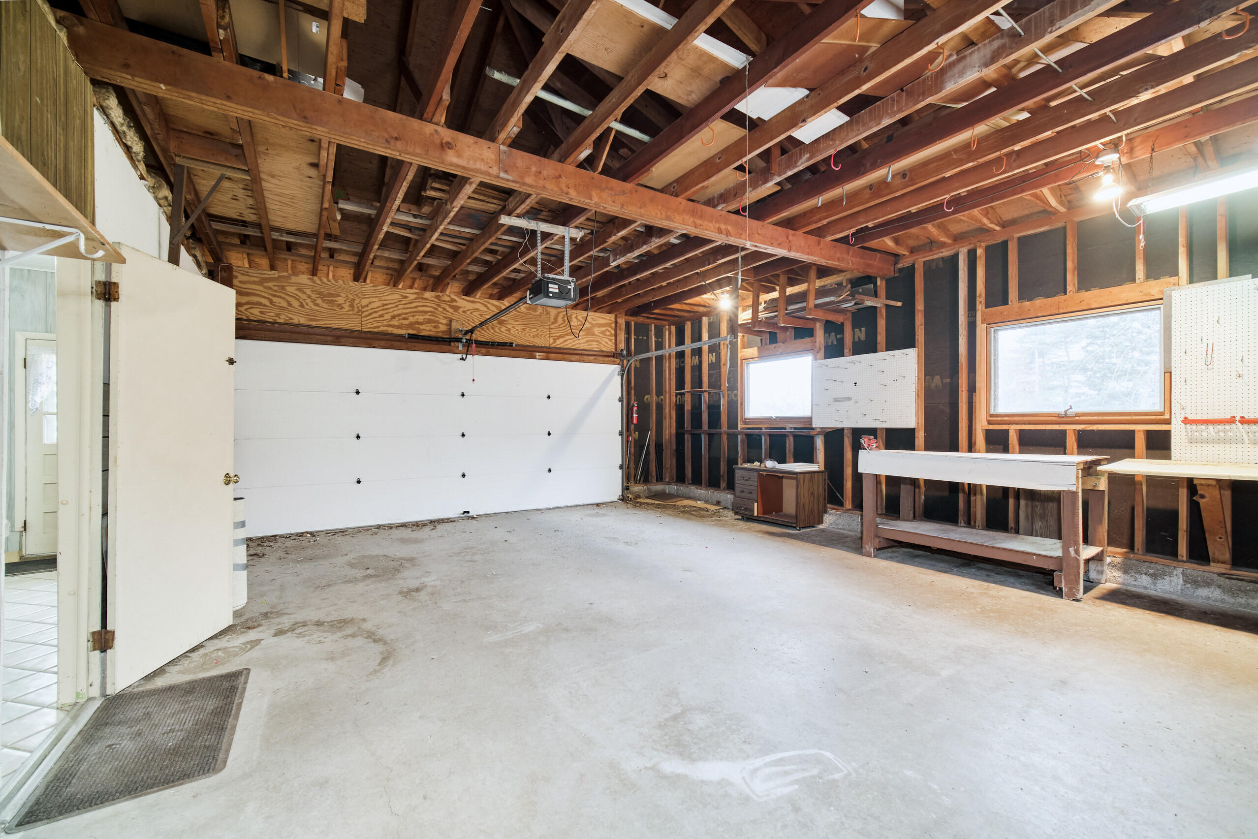 302 Condon Road Manistee, MI 49660 - Photo 39 of 56 Attached garage with door to mud room