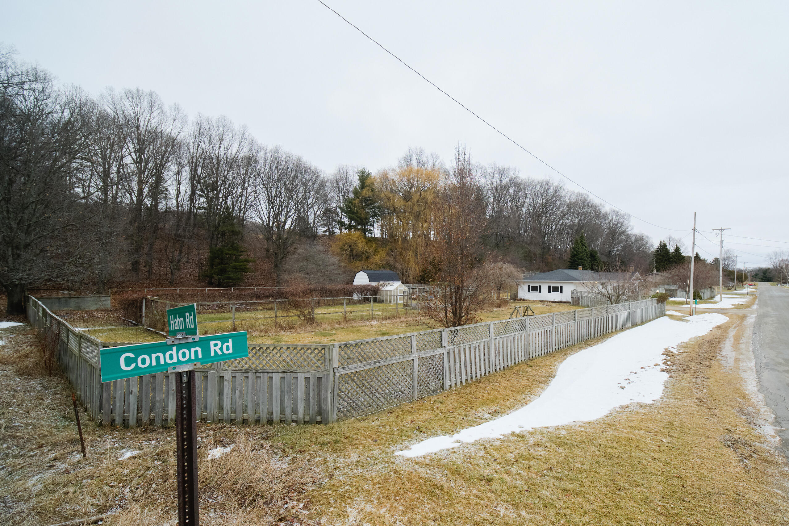 302 Condon Road Manistee, MI 49660 - Photo 48 of 56 Entire parcel has wood privacy fencing