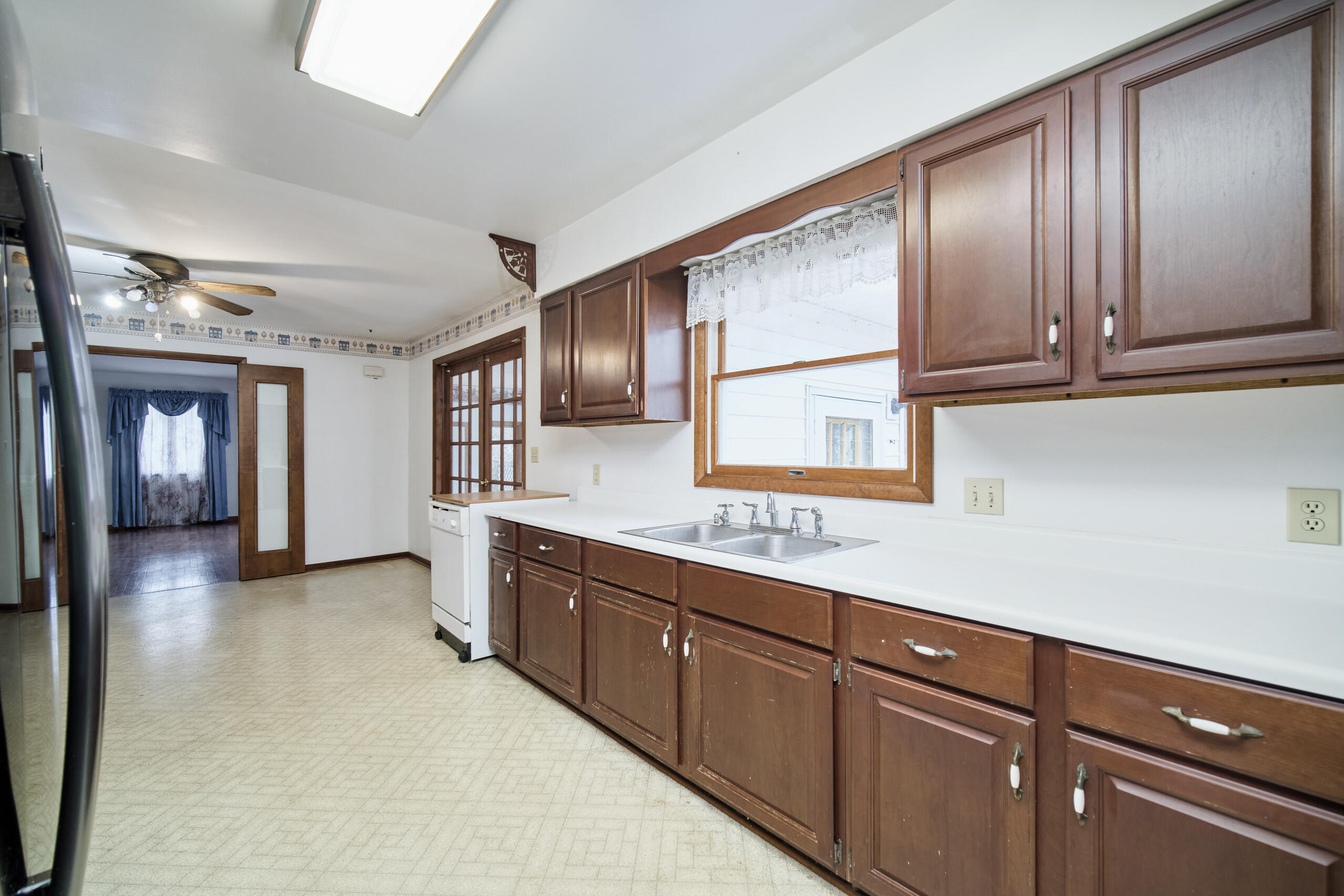 302 Condon Road Manistee, MI 49660 - Photo 6 of 56 Kitchen w/patio doors to sunroom