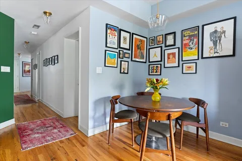 a view of a dining room with furniture and wooden floor