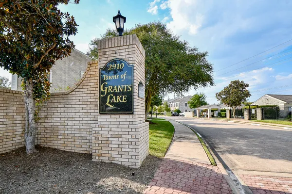 a pathway of a house with a yard