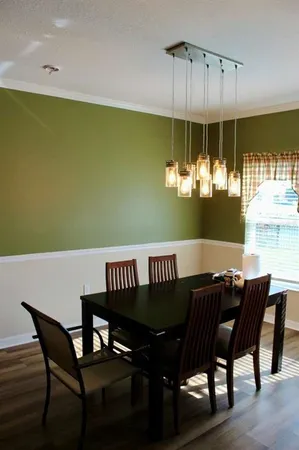 a view of a dining room with furniture and window