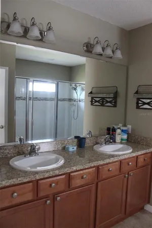 a bathroom with sink and mirror