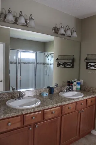 a bathroom with sink and mirror