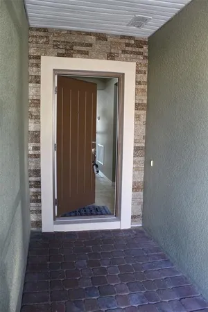 an entryway view with wooden floor