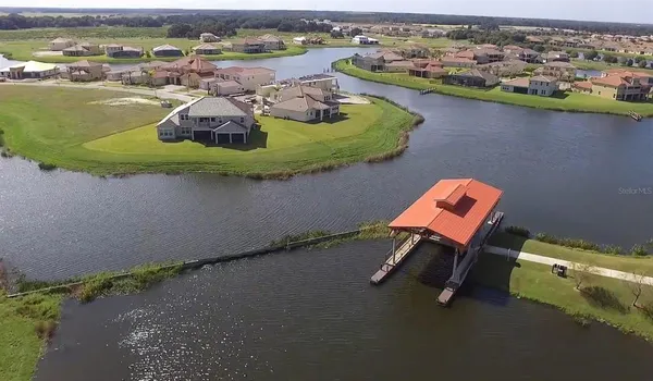 an aerial view of a house with a ocean view