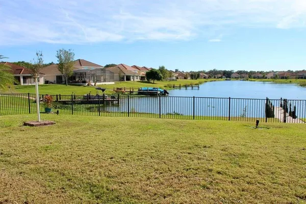 a view of a lake with a big yard