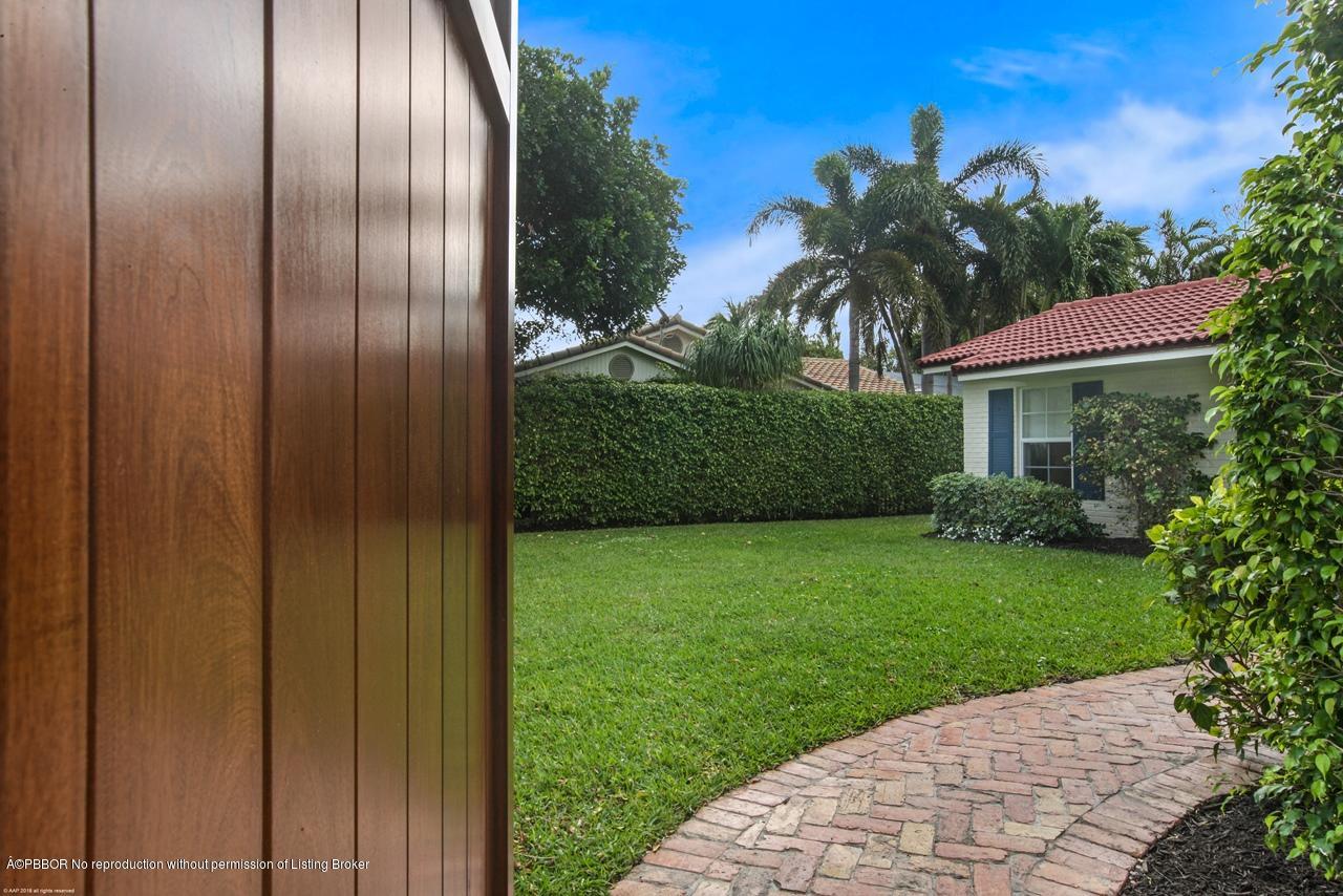 11 Ridge Boulevard Ocean Ridge, FL 33435 - Photo 5 of 26 a view of a yard in front of a house