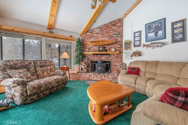 a living room with furniture and a dining table