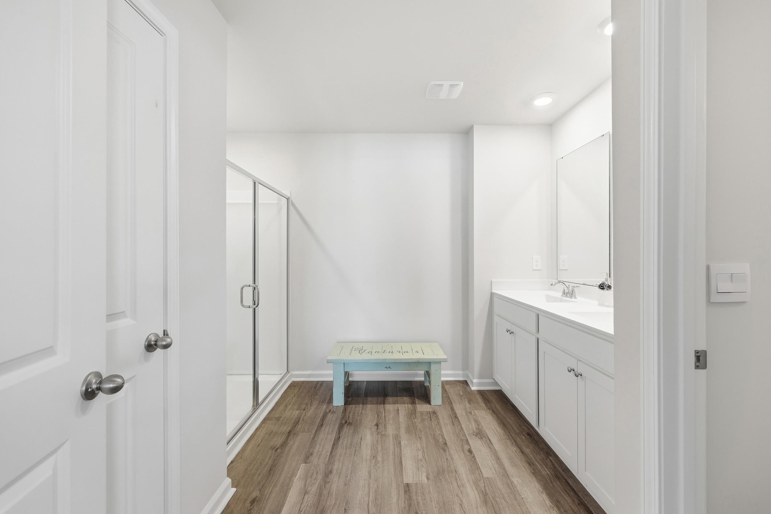 308 Picnic Basket Place Longs, SC 29568 - Photo 22 of 40 Full bathroom featuring light wood-style flooring, double vanity, and a stall shower